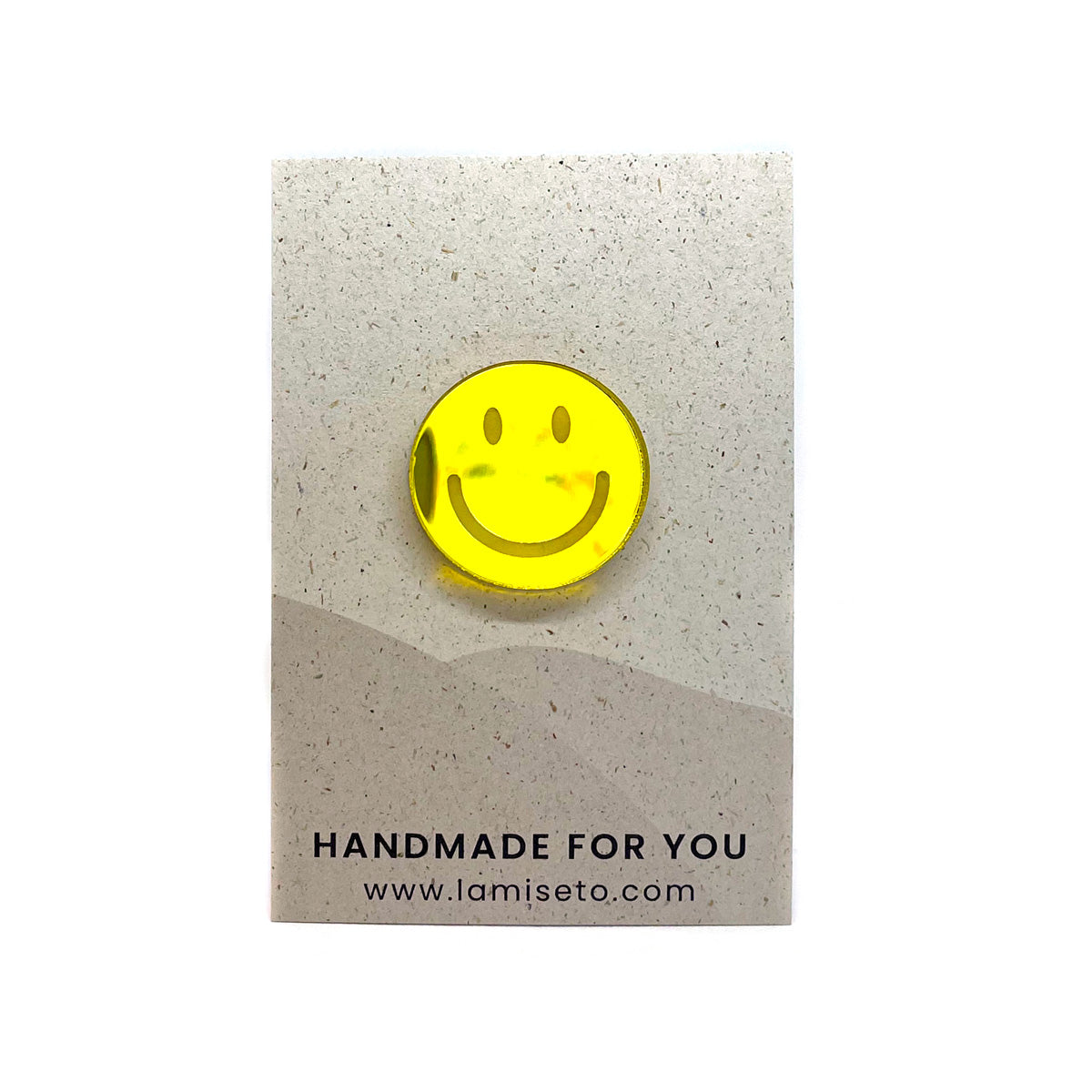 Smiley brooch